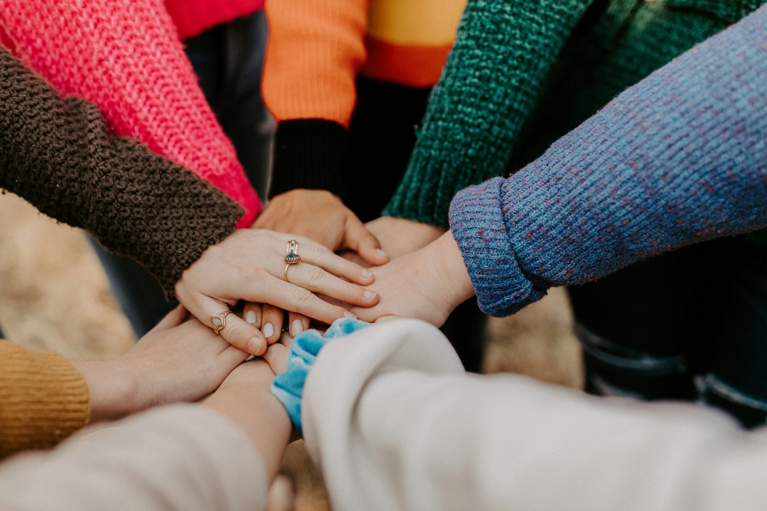 A group of hands in a circle